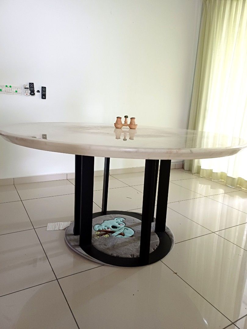 Solid Round Marble Dining Table (Category: Tables & Sets) located in Puchong. Submitted by derricklau95 (Listing ID 1407151477, Image 3). Description: This round, white marble table features a sleek polished surface with beautiful natural veining, bringing a clean and modern look to any space. Designed with a strong steel base for excellent stability, it comfortably accommodates more than 6 seaters. Perfect for dining rooms, meeting areas, or spa