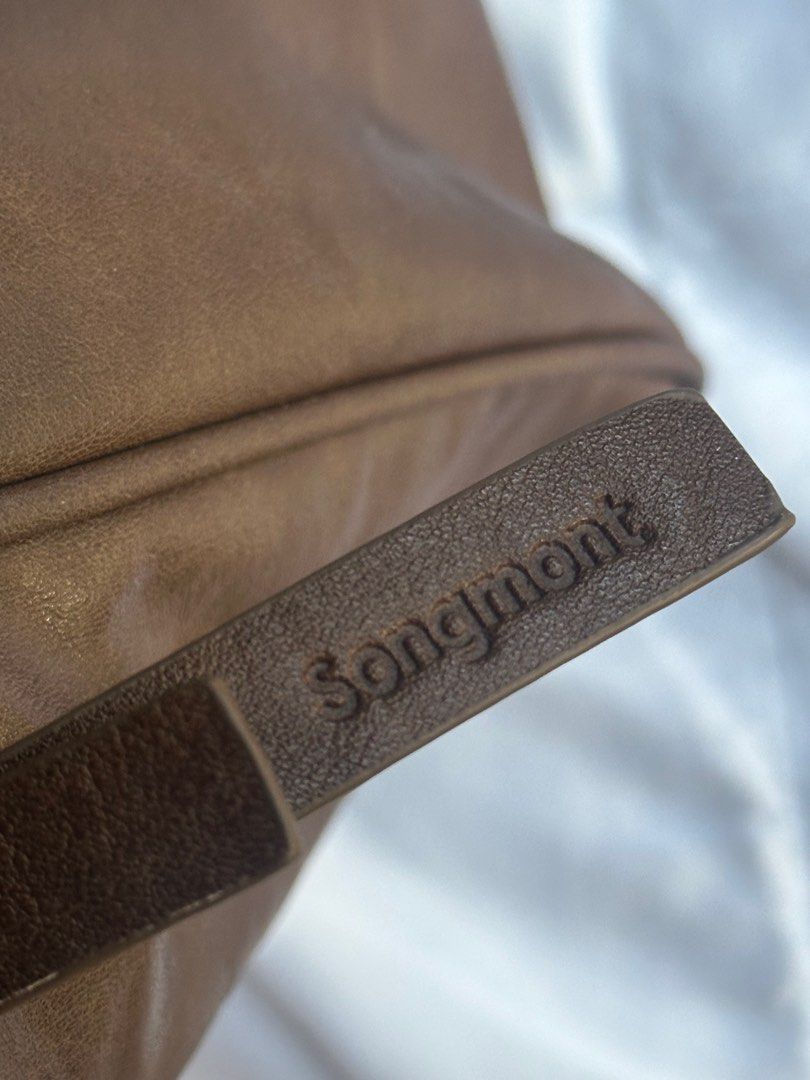 Songmont Small Yore Duffle Bag (Category: Luxury Bags & Wallets) located in Taguig. Submitted by dany29 (Listing ID 1407017025, Image 3). Description: Leather is super soft and smooth. Complete legs - can stand. Bought here in Carousell. Authenticity NOT guaranteed. NO strap. No ring. .