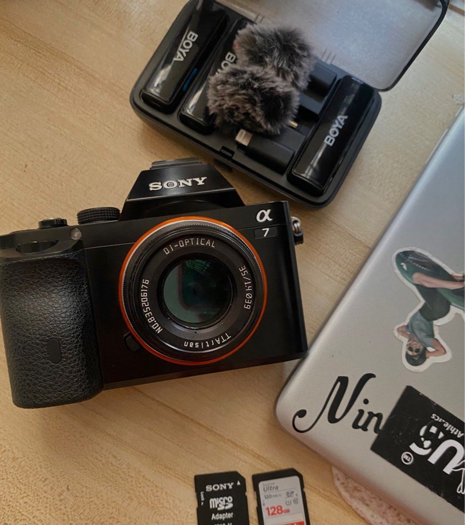 Sony Alpha 7 Camera with TTArtisan 35mm Lens (Category: Cameras) located in Mandaluyong City. Submitted by bstkolkol (Listing ID 1407086334, Image 2). Description: - Sony Alpha 7 camera (black) - TTArtisan 35mm lens (red accent ring).
