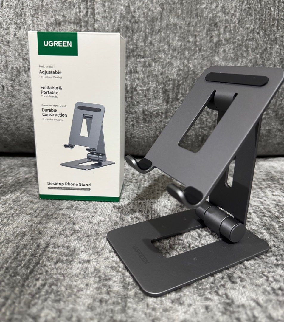UGreen Adjustable & Foldable Desktop Phone Stand (Category: Mounts & Holders) located in Makati City. Submitted by jc.cuerdo (Listing ID 1407179155, Image 2). Description: UGreen Adjustable & Foldable Desktop Phone Stand UGREEN LP678 folding stand for phone Bet on comfort during your daily activities with phone! UGREEN LP678 is a practical stand with customizable angle. Designed for phone and tablets up to 7.9’’ it guarantees wymaganą stability i