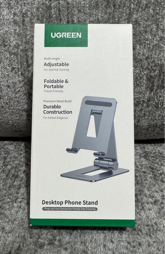 UGreen Adjustable & Foldable Desktop Phone Stand (Category: Mounts & Holders) located in Makati City. Submitted by jc.cuerdo (Listing ID 1407179155, Image 1). Description: UGreen Adjustable & Foldable Desktop Phone Stand UGREEN LP678 folding stand for phone Bet on comfort during your daily activities with phone! UGREEN LP678 is a practical stand with customizable angle. Designed for phone and tablets up to 7.9’’ it guarantees wymaganą stability i