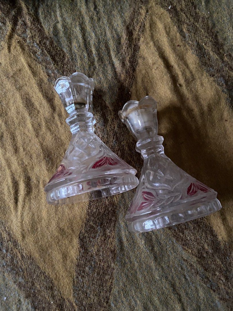 Vintage Glass Candle Holders (Category: Other Home Decor) located in Rizal. Submitted by mishyboo (Listing ID 1407000771, Image 2). Description: - Set of two vintage candle holders - Clear glass design - Features red floral accents - Unique shape with flared base - Detailed top - Perfect for vintage decor - Creates a warm atmosphere -need wash.