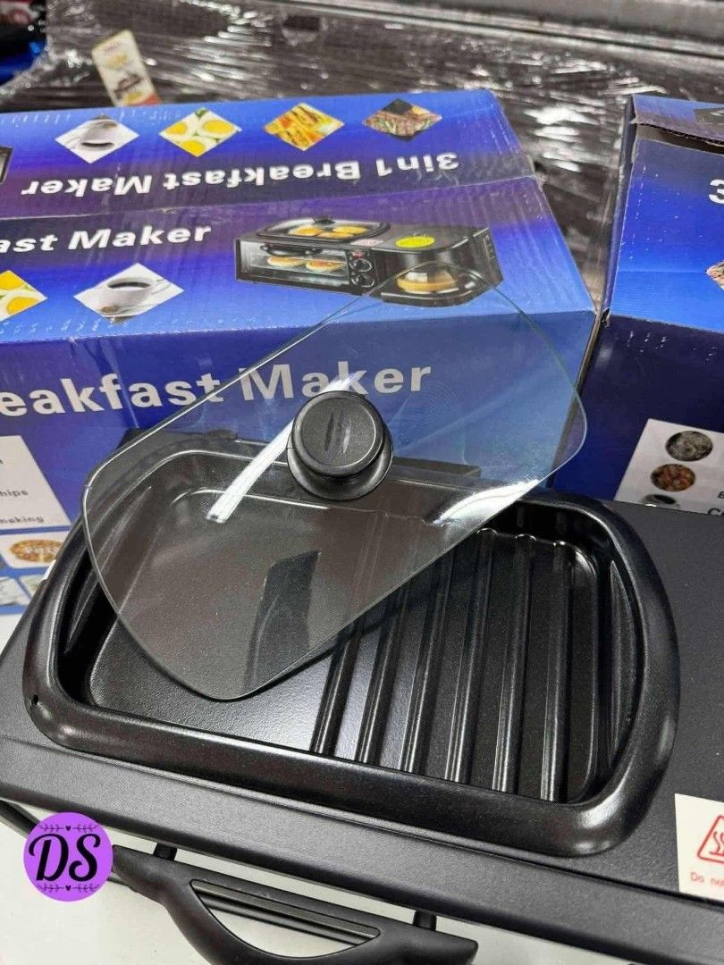 3-in-1 Breakfast Maker (Category: Coffee Machines & Makers) located in Mandaluyong City. Submitted by shopmla (Listing ID 1402194912, Image 2). Description: 3-in-1 breakfast maker includes a toaster oven, coffee maker, and griddle. It can fry eggs, sausage, and bacon. The toaster oven has a glass door and a timer. The coffee maker has an on/off switch. The griddle has a lid. Perfect for making a complete breakfast in one appliance..