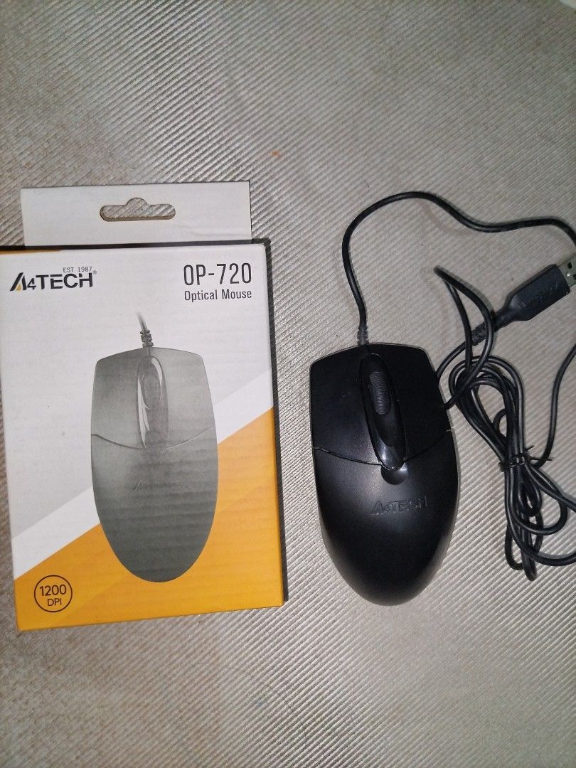 A4Tech OP-720 Optical Mouse (Category: Mouse & Mousepads) located in Manila. Submitted by nittygritty2 (Listing ID 1402274825, Image 1). Description: A4Tech OP-720 optical mouse. Features include 1200 DPI, 5M clicks lifecycle, 8-in-one gesture, and a dust-resistant wheel. It has a 4-way smart wheel and a symmetric fit design. It is a plug-and-play USB mouse. The color is black..