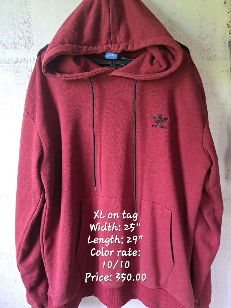 Adidas Hoodie XL (Category: Hoodies) located in Calamba. Submitted by lnmrzzllch (Listing ID 1400254537, Image 1). Description: Maroon Adidas hoodie with black stripes on the sleeves. Features a hood with drawstrings and a front pocket. The tag indicates an XL size. Width is 25 inches and length is 29 inches. The color rate is 10/10. Price is 400.00..