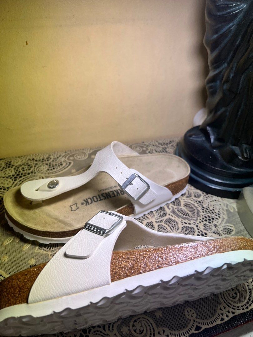 Birkenstock Gizeh Birko-Flor White Sandals (Category: Flats & Sandals) located in Makati City. Submitted by giftidea123 (Listing ID 1402142975, Image 1). Description: White Birkenstock Gizeh sandals. Features a thong strap design with a buckle closure. The footbed is made of cork. The size is 35, equivalent to 225mm. The sandals are white in color. Made in Germany. Selling for 4050 neverbeen used Issue : Stain on foot bed .