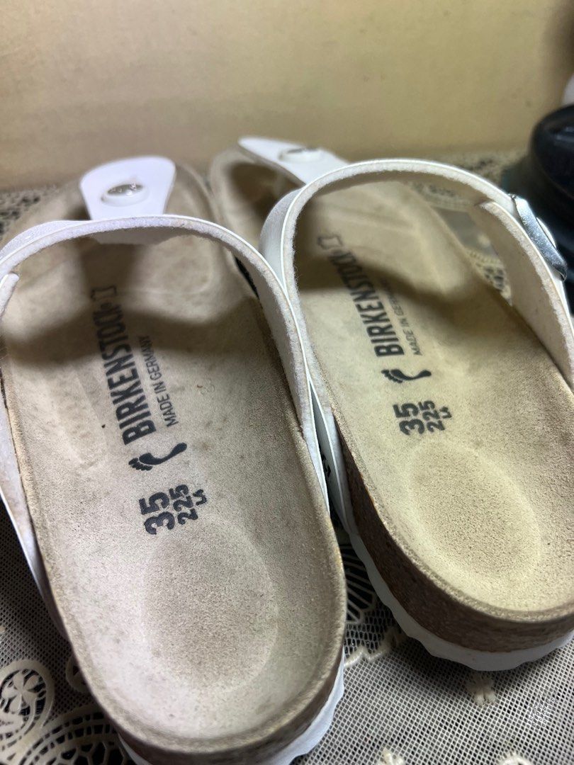 Birkenstock Gizeh Birko-Flor White Sandals (Category: Flats & Sandals) located in Makati City. Submitted by giftidea123 (Listing ID 1402142975, Image 2). Description: White Birkenstock Gizeh sandals. Features a thong strap design with a buckle closure. The footbed is made of cork. The size is 35, equivalent to 225mm. The sandals are white in color. Made in Germany. Selling for 4050 neverbeen used Issue : Stain on foot bed .