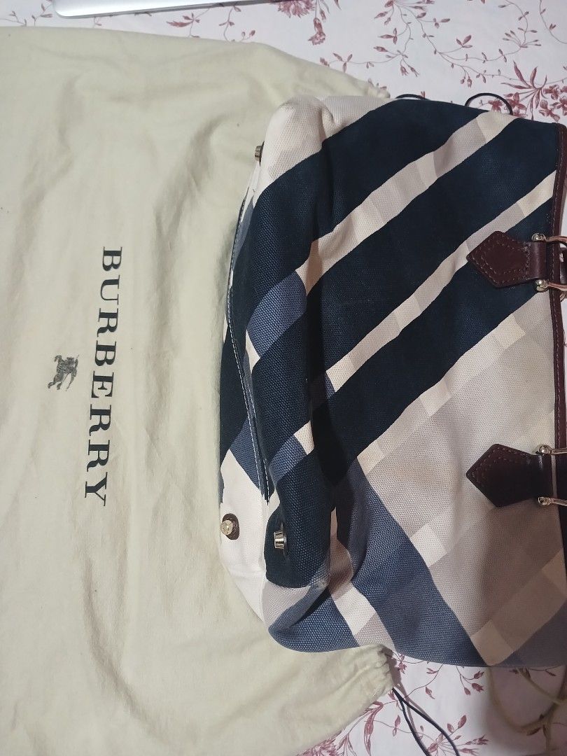 Burberry Checkered Tote Bag (Category: Luxury Bags & Wallets) located in Marikina City. Submitted by laila15 (Listing ID 1402278447, Image 3). Description: - Authentic Burberry tote bag - Classic checkered pattern (blue, white, beige) - Brown leather handles and trim - Includes dust bag with Burberry logo - Metal feet on the bottom Available .
