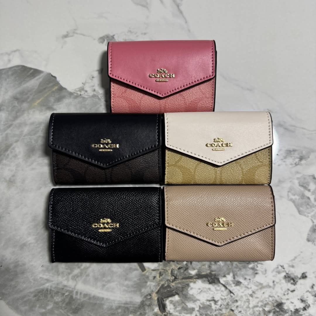 Coach Flap Card Case (Category: Luxury Bags & Wallets) located in Santa Cruz. Submitted by Authentic_Branded_Bags (Listing ID 1402230787, Image 1). Description: - Coach flap card case - Available colors: Black, Pink, Beige - Features Coach logo - Flap closure - Includes tag and box.