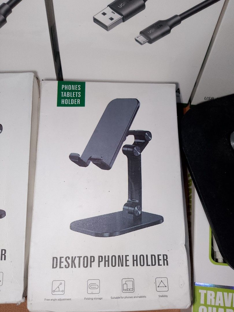 Desktop Phone Holder (Category: Mounts & Holders) located in Rizal. Submitted by heartieshop1425 (Listing ID 1402216269, Image 1). Description: Desktop phone holder is designed for phones and tablets. It features cross-angle adjustment and folding storage for convenience. The holder is suitable for various scenarios. The design is sleek and modern, perfect for any desk or workspace. It provides a stable and adjustable platform for your device. Sh