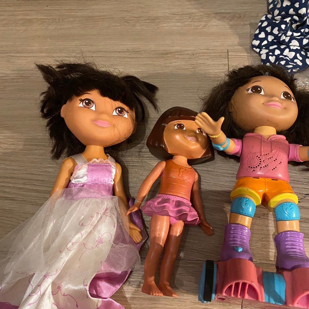 Dora the Explorer Dolls (Category: Kids Toys) located in Pasay City. Submitted by tindarela (Listing ID 1402153494, Image 2). Description: - Dora the Explorer doll collection. - Includes Dora dolls in various outfits. - Some dolls come with accessories. - Perfect for playtime or collecting. - Great for kids who love Dora the Explorer. For take all na po what you see is what you get.