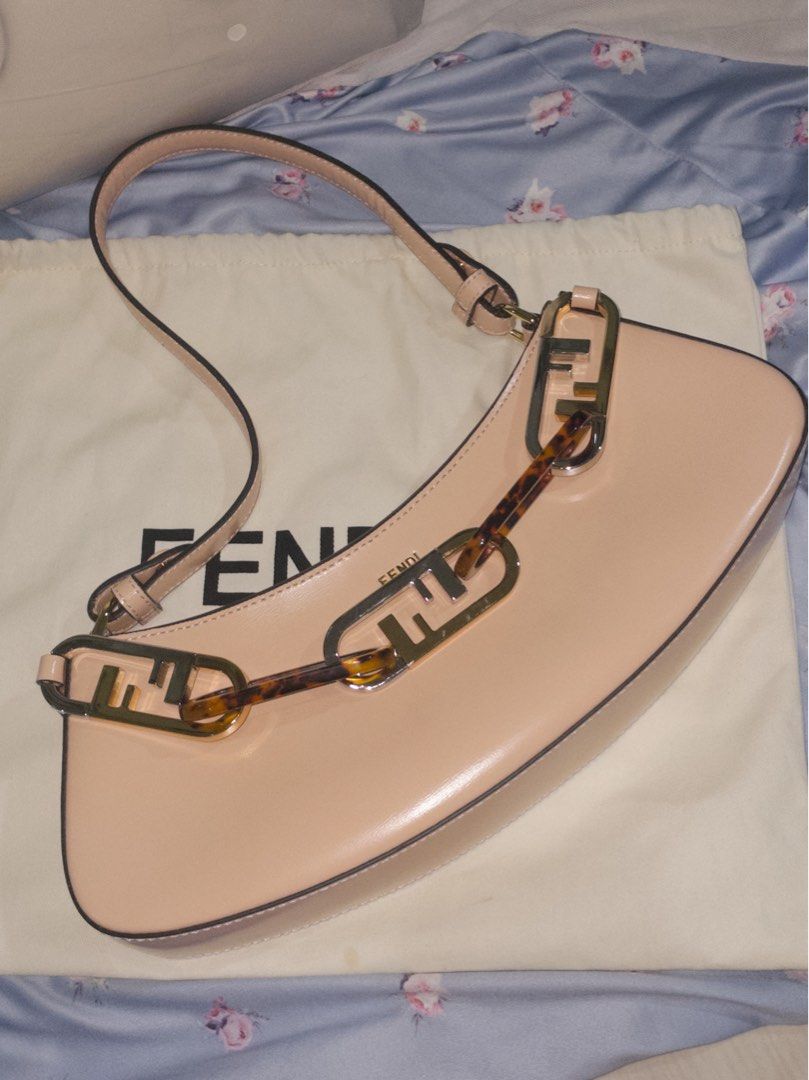 Fendi Roma Baguette Bag (Category: Luxury Bags & Wallets) located in Manila. Submitted by kristelleluxxe (Listing ID 1402223526, Image 1). Description: - Quality Fendi Baguette - Soft pink color - Unique chain detail with Fendi logo - Top handle - Zip closure - Interior pocket - Made in Italy.