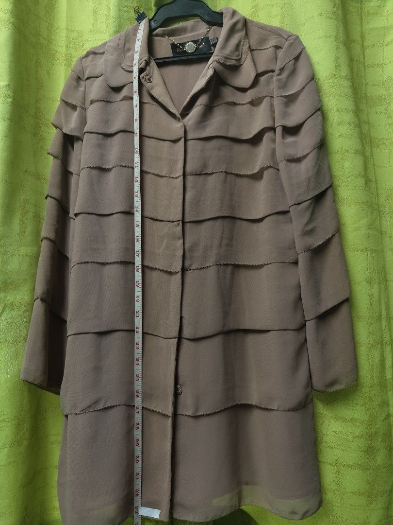 Getmodern Direction Ruffle Coat (Category: Coats, Jackets and Outerwear) located in Manila. Submitted by declutterwithme0809 (Listing ID 1402132911, Image 2). Description: - Getmodern Direction coat - Unique layered ruffle design - Collared neckline - Button-down closure - Neutral color - Medium size - Chain detail at neckline All items can be shipped thru lalamove,J&T,LBC. (no to free shipping) if i can't reply asap you can also message me on me