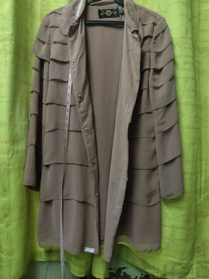 Getmodern Direction Ruffle Coat (Category: Coats, Jackets and Outerwear) located in Manila. Submitted by declutterwithme0809 (Listing ID 1402132911, Image 3). Description: - Getmodern Direction coat - Unique layered ruffle design - Collared neckline - Button-down closure - Neutral color - Medium size - Chain detail at neckline All items can be shipped thru lalamove,J&T,LBC. (no to free shipping) if i can't reply asap you can also message me on me