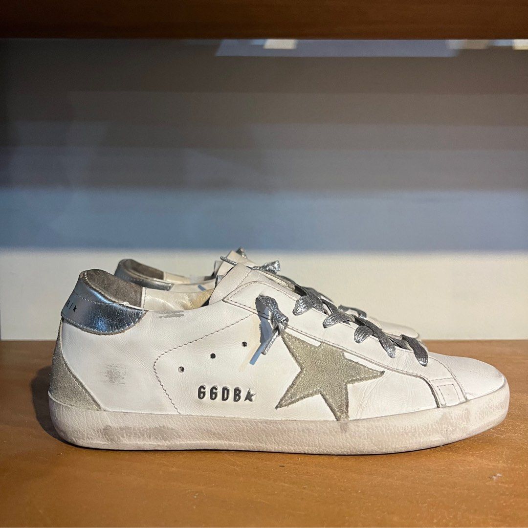 Golden Goose Super-Star Classic Sneakers (Category: Sneakers) located in Binan City. Submitted by lovedbynins (Listing ID 1402215860, Image 1). Description: Authentic Golden Goose Super-Star Classic with Spur sneakers size 40 Color: white/ice/silver Made in Italy. The sneakers have a distressed look, which is part of the design. Inclusion: original box, dust bag, and Golden Goose passport. Only used a few times. Please check and zoom photos for d