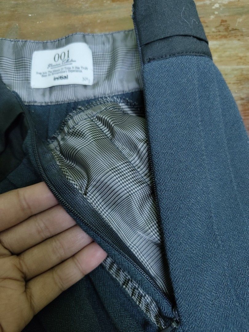 Initial Pleated Wide Leg Pants (Category: Other Bottoms) located in Manila. Submitted by declutterwithme0809 (Listing ID 1402146827, Image 3). Description: - Brand: Initial - Style: Wide-leg pants - Features: Pleated front, zipper closure, patterned lining - Color: Dark - Design: Elegant and comfortable - Waistline is 28 - Length is 37 ½ .