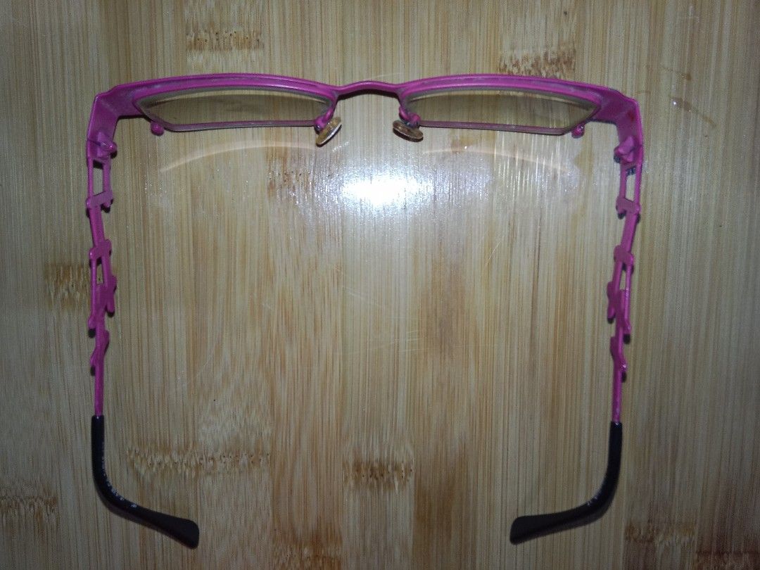 JP Morgan Pink and Black Eyeglasses (Category: Sunglasses & Eyewear) located in Manila. Submitted by 90ninety (Listing ID 1402112150, Image 3). Description: - Stylish eyeglasses with a unique pink and black design - Distinctive pattern on top and sides of the frames - Personal use, need to clean/replace nose pads.