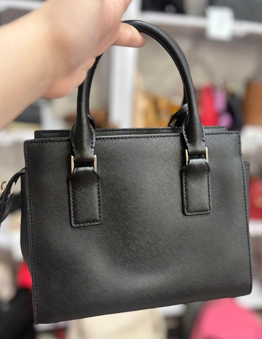 Kate Spade Cameron street black bag (Category: Luxury Bags & Wallets) located in Valenzuela. Submitted by ryu12 (Listing ID 1402276854, Image 2). Description: - Black Kate Spade Cameron street black bag - Top handle design with sling - Detachable tag included - Structured shape - Front pocket - Gold-tone hardware - Kate Spade logo on front - Made of a textured material - no flaws -RFS: decluttering .
