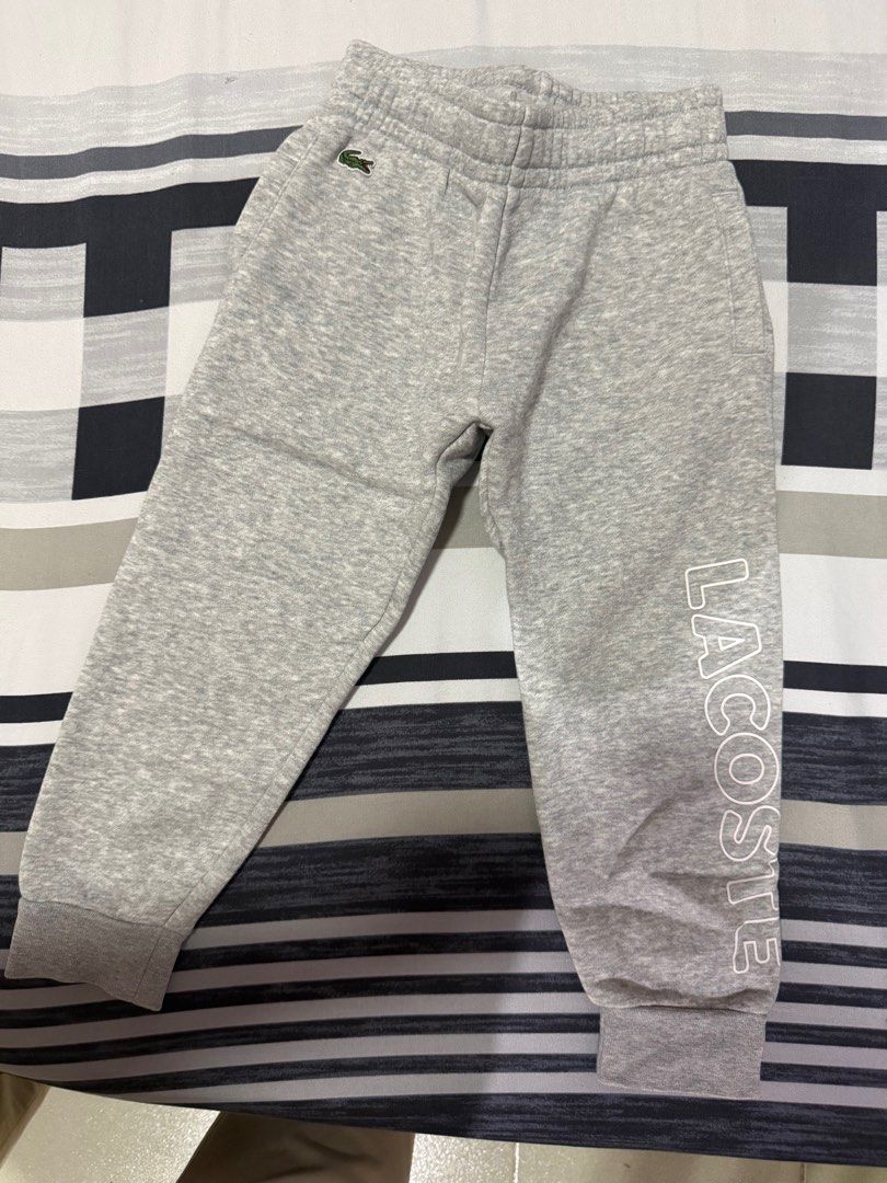Lacoste Kids Sweatpants Size 4 (Category: Babies & Kids Fashion) located in Naic. Submitted by joancust (Listing ID 1402222634, Image 1). Description: - Lacoste sweatpants for kids - Size: 4 (fits height 104cm / 41 inches) - Features Lacoste logo on leg - Iconic crocodile logo on front - Elastic waistband and cuffs.