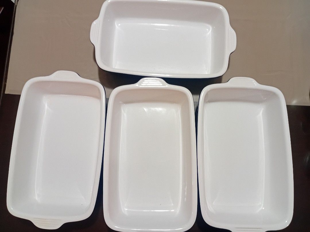 Lodge Baking Dish (Category: Bakeware) located in Santa Rosa. Submitted by mariekarol23638 (Listing ID 1396876952, Image 2). Description: - P900 each - Lodge rectangular baking dish set - Includes two dishes - Features a dark blue exterior and light colored interior - Lodge logo visible - Ideal for baking casseroles, desserts, and more - Durable and oven-safe.