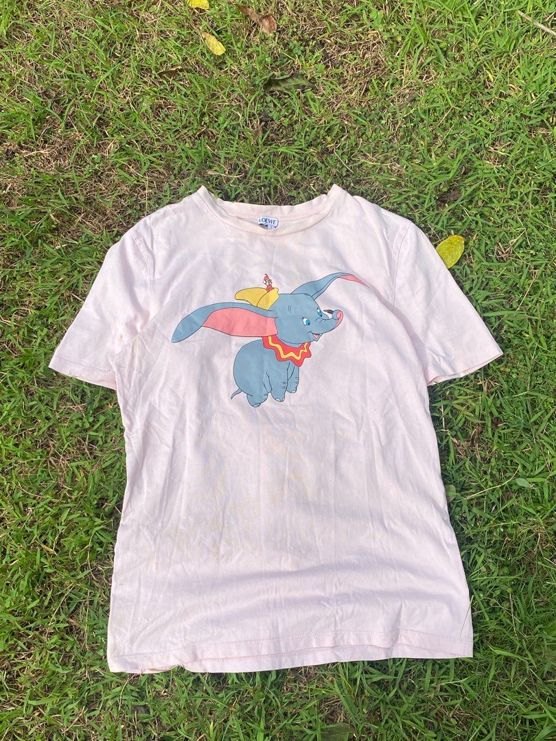 Loewe x Dumbo T-shirt (Category: Tshirts & Polo Shirts ) located in Cavite. Submitted by aintrich (Listing ID 1402224275, Image 2). Description: - Loewe x Disney collaboration - Features a Dumbo graphic - Loewe logo on the back Complete Tags Need Wash.