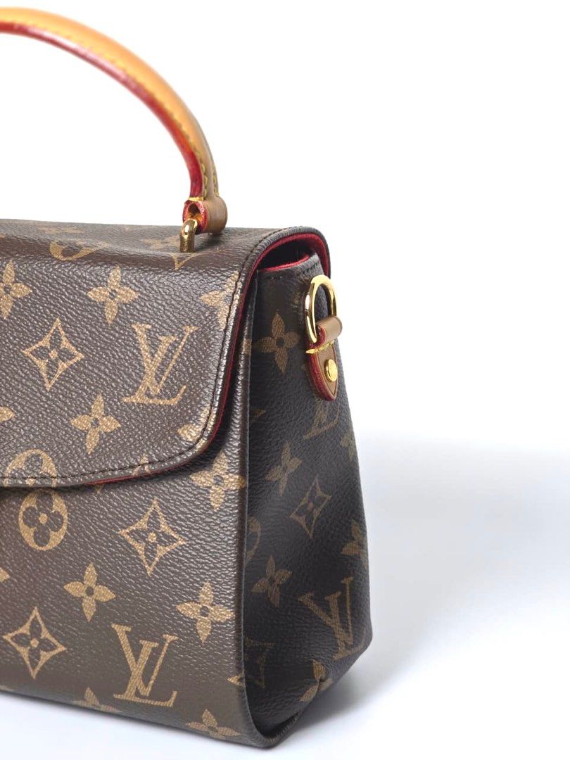 Louis Vuitton Croisette in Monogram Coated Canvas (Category: Luxury Bags & Wallets) located in Pandi. Submitted by luximperium (Listing ID 1402105313, Image 3). Description: Details: Color: Brown Includes: Detachable shoulder strap, Dust bag, Removable tassel Material: Monogram Coated Canvas (Exterior) & Smooth black cowhide leather trim (Exterior), Red fabric (Interior) Size: Small Dimensions: L (23cm), H (15cm), W (9cm), HD (9cm), S (117.5 cm) 