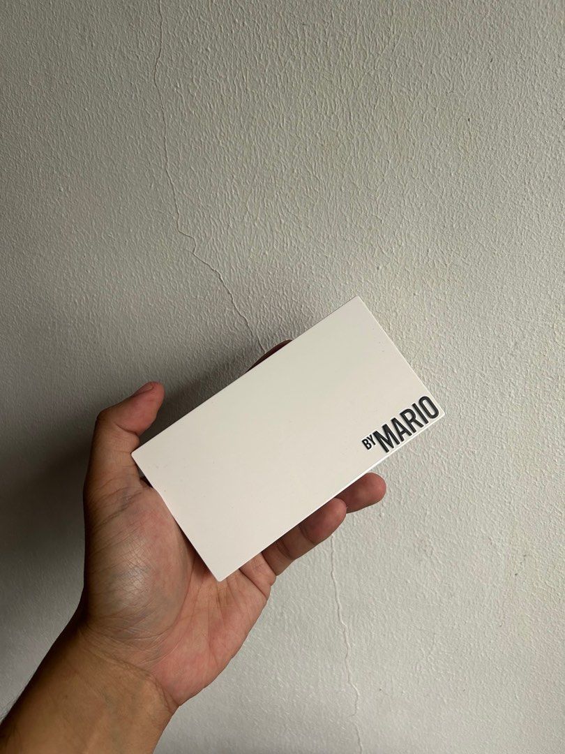 Makeup by Mario Metallic Eyeshadow Palette (Category: Makeup) located in Mandaluyong City. Submitted by quainvanity (Listing ID 1402134346, Image 2). Description: - metallic eyeshadow palette - Features a range of cool to warm tones - Comes in a white, branded case - Compact and travel-friendly size.