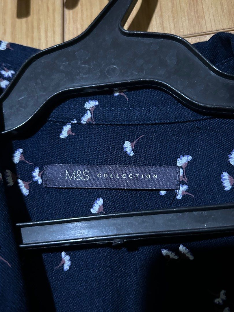 Marks & Spencer Navy Blue Floral Polo - Size Large (Category: Blouses) located in Mabalacat. Submitted by icedoatmatcha (Listing ID 1402209582, Image 2). Description: ‼️ BUY 2 OR MORE FROM MY LISTINGS AND GET FREE SHIPPING selling my mom’s clothes! 👚 Marks & Spencer Navy Blue Floral Polo - Size Large - mop: gcash/bdo - mod: j&t only - loc: pampanga.