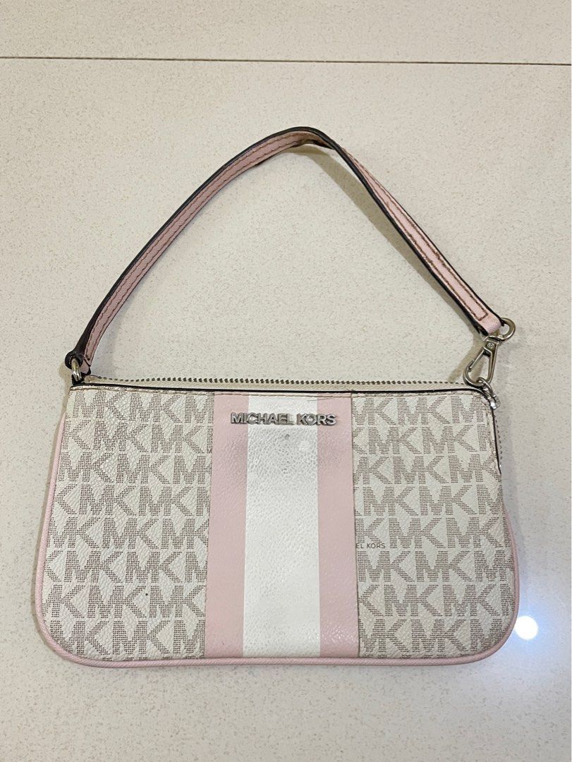 Michael Kors Pink and White Monogram Shoulder Bag (Category: Luxury Bags & Wallets) located in Cagayan de Oro. Submitted by suta.__.ph (Listing ID 1402176254, Image 1). Description: Elegant Michael Kors shoulder bag in light beige monogram print with pink and white center stripe detail. Compact and stylish — perfect for casual or semi-formal looks. • Color: Beige/pink/white • Interior: Clean with MK logo lining and small pocket • Condition: Good 