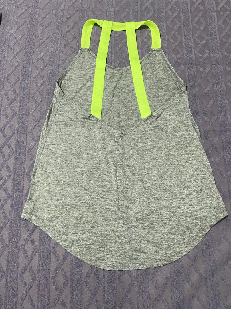 Nike Dri-FIT Tank Top - XS (Category: Activewear) located in San Narciso. Submitted by prelovedbentables (Listing ID 1402121348, Image 3). Description: - Nike Dri-FIT tank top - Gray with neon green accents - Features Nike logo - Unique back strap design - Size: XS - Made in Thailand.