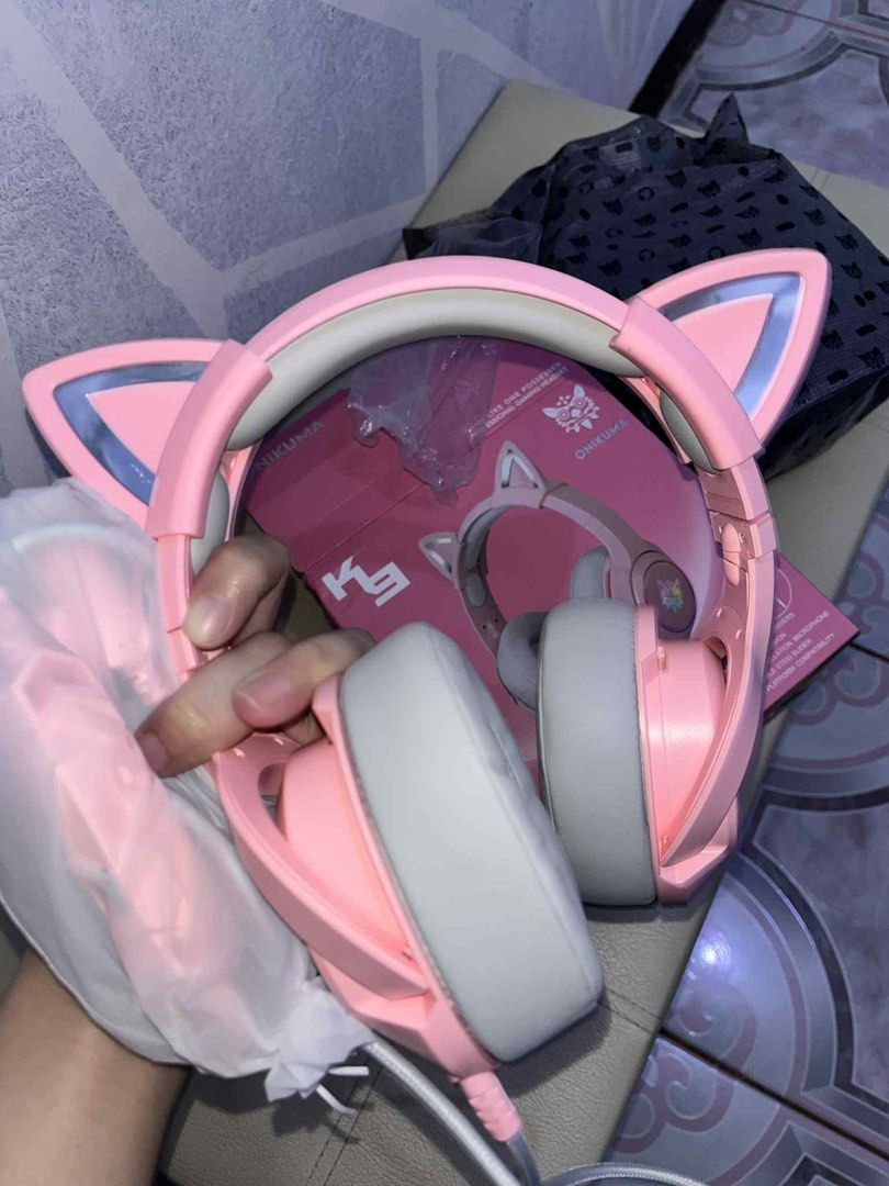 Onikuma K9 Professional Gaming Headset Pink Cat ear design (Category: Headphones & Headsets) located in Antipolo. Submitted by gossipgurlxoxo (Listing ID 1402181971, Image 2). Description: - never been used, tested lang - producing high quality sounds - soft earmuffs -headbeam can be adjusted - very clear and noise cancelling mic - has rgb led light feature - cat ear design is detachable - slightly negotiable price, just offer :).