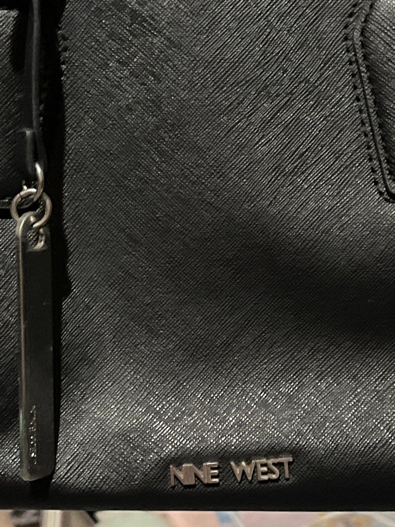 ORIG NINE WEST black hand bag (Category: Purses & Pouches) located in Pasig City. Submitted by skydecluttering (Listing ID 1402240824, Image 2). Description: negotiable has signs of usage.