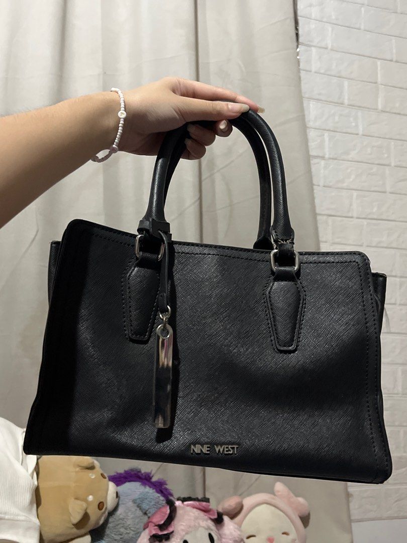 ORIG NINE WEST black hand bag (Category: Purses & Pouches) located in Pasig City. Submitted by skydecluttering (Listing ID 1402240824, Image 1). Description: negotiable has signs of usage.