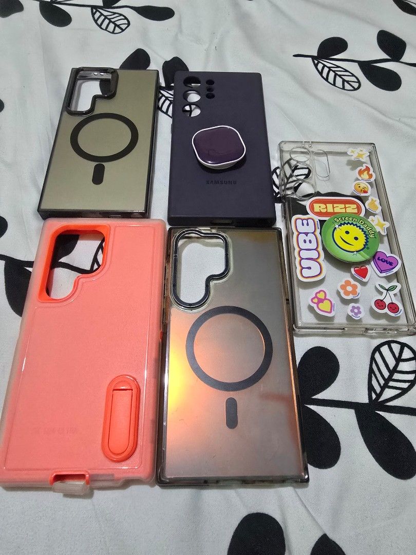 Phone Cases <S24 Ultra> (Category: Cases & Sleeves) located in Mandaluyong City. Submitted by telesthesiaph (Listing ID 1402251879, Image 1). Description: Cases - All for one price! Includes Spigen clear case with pop socket, violet silicone case, and other orange app finds. Free shipping..