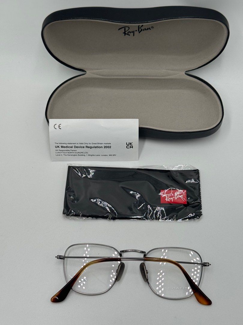 Ray-Ban Titanium Eyeglasses (Category: Sunglasses & Eyewear) located in Quezon City. Submitted by _cmluxephilippines (Listing ID 1402136881, Image 3). Description: Ray-Ban Frank Titanium Eyeglasses The glasses in the image are identified as the Ray-Ban Frank Titanium Optics eyeglasses. They are a unisex style featuring a square shape and a frame made of lightweight and durable titanium. Product Details Model Name: Frank Titanium Optics Model Code
