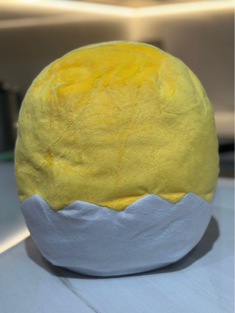Sanrio Gudetama Plush Toy (Category: Plushies & Soft Toys) located in Taguig. Submitted by beerackph (Listing ID 1402228543, Image 2). Description: - Adorable Gudetama plush toy! - Features the iconic lazy egg design. - Soft and cuddly material. - Perfect for snuggling. - Includes a small pocket at the back. - Authentic Sanrio tag is visible..