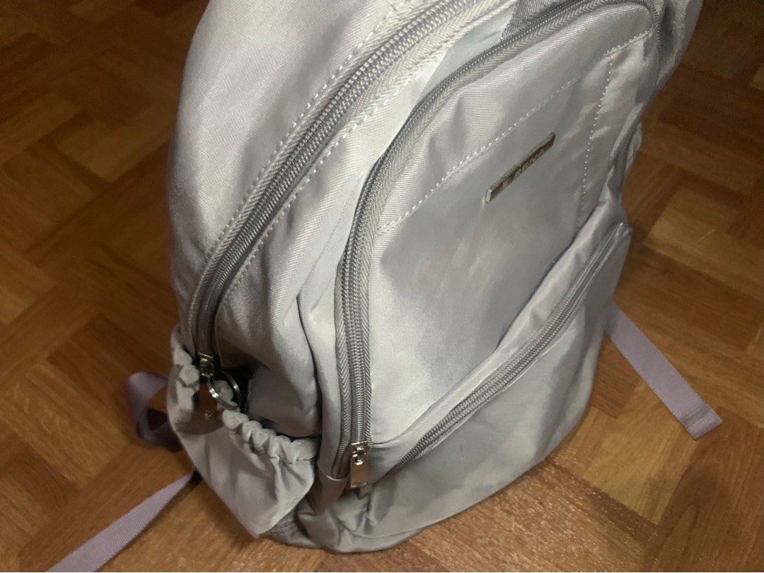 Sena Backpack - Gray (Category: Backpacks) located in Muntinlupa City. Submitted by ivyxfolklore (Listing ID 1402194797, Image 3). Description: purple-grey backpack for women - only used thrice for school -has a lot of compartments - too big for me ( I only use a small bag ).