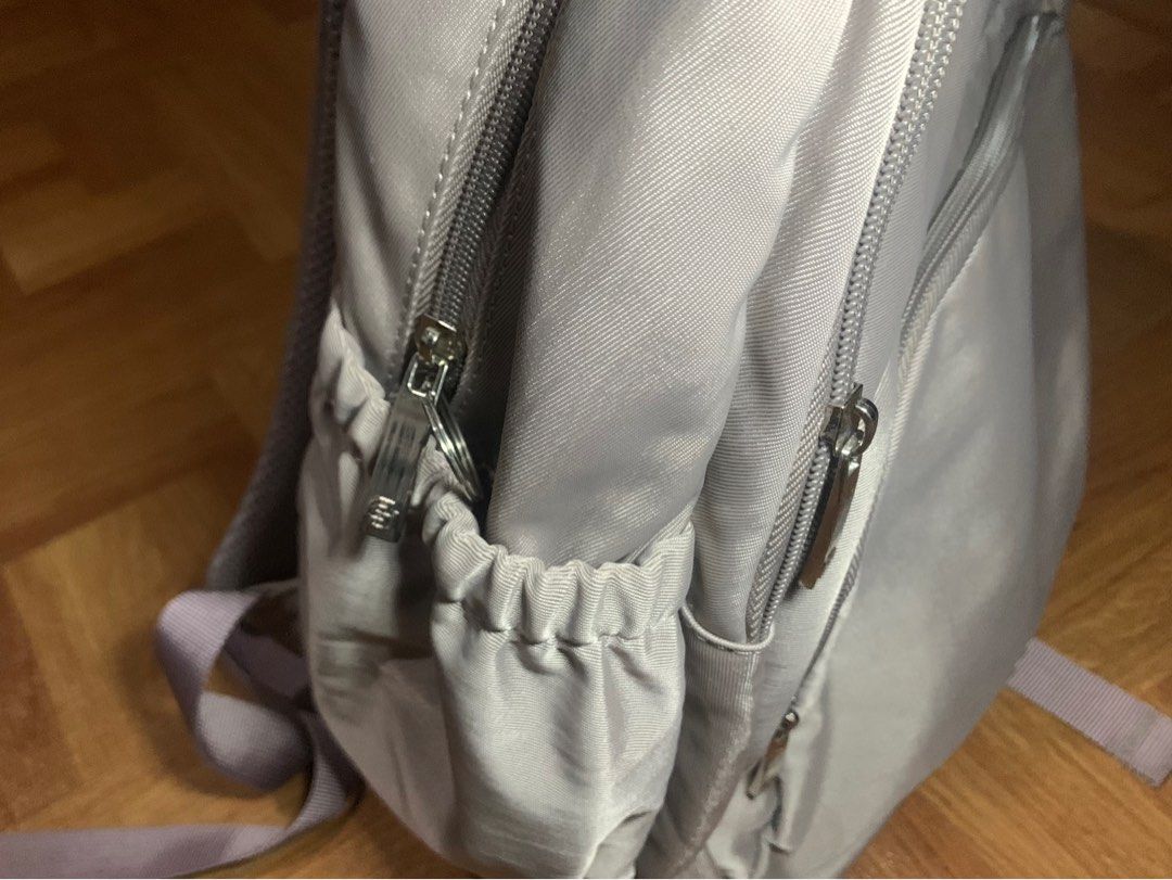 Sena Backpack - Gray (Category: Backpacks) located in Muntinlupa City. Submitted by ivyxfolklore (Listing ID 1402194797, Image 2). Description: purple-grey backpack for women - only used thrice for school -has a lot of compartments - too big for me ( I only use a small bag ).