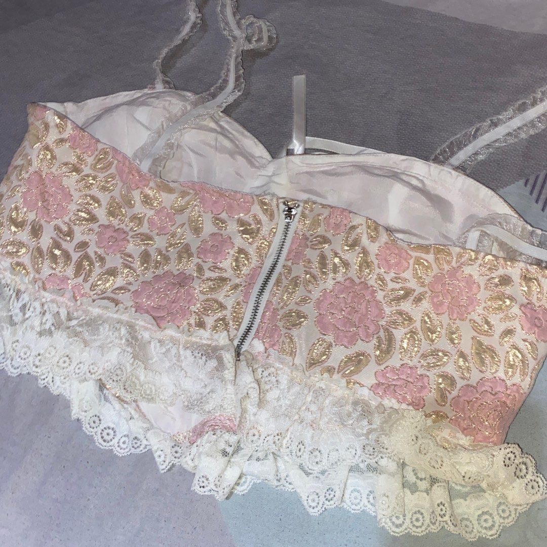 Shein Floral Lace Corset Top (Category: Sleeveless) located in Las Pinas. Submitted by azzyplane (Listing ID 1402175189, Image 2). Description: - Shein corset top - Size: L - Floral pattern with pink and gold accents - Delicate lace trim and straps - Back zipper closure - Small bow detail at the front.