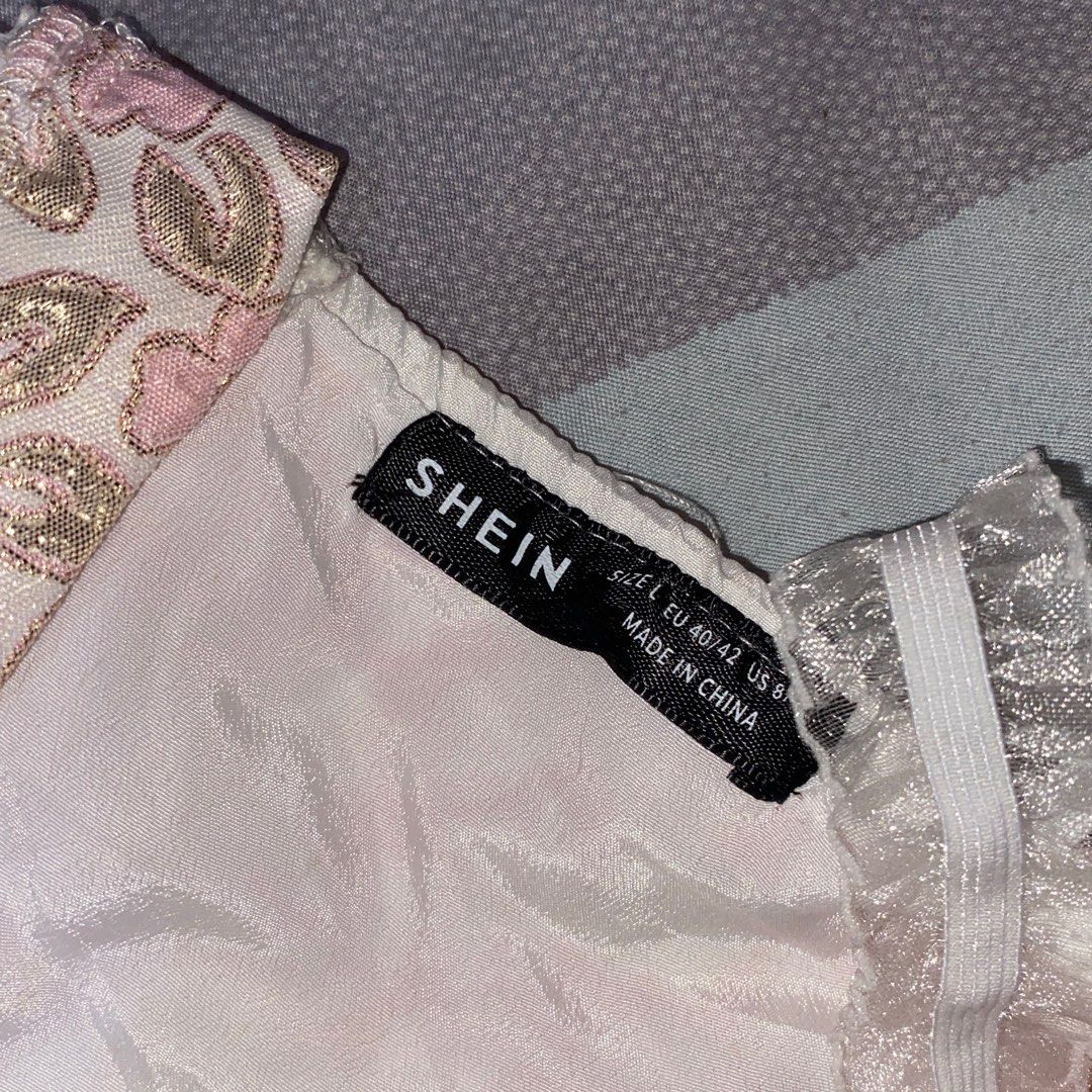Shein Floral Lace Corset Top (Category: Sleeveless) located in Las Pinas. Submitted by azzyplane (Listing ID 1402175189, Image 3). Description: - Shein corset top - Size: L - Floral pattern with pink and gold accents - Delicate lace trim and straps - Back zipper closure - Small bow detail at the front.