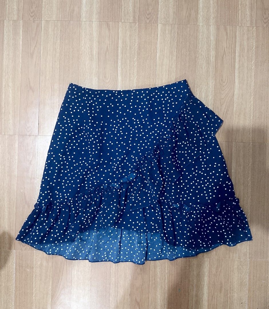 SHEIN Polka Dot Ruffle Skirt - Size M (Category: Skirts) located in Quezon City. Submitted by jay0708 (Listing ID 1402173099, Image 2). Description: - SHEIN skirt - Navy blue with white polka dots - Ruffle hem detail - Wrap style design - Size: M (EU 38, US 6) - Material: 100% polyester - Made in China P.S it's the same as the white listed item skirt just a diff color ( both items could fit a small and a medium ) pm for exact measurements.