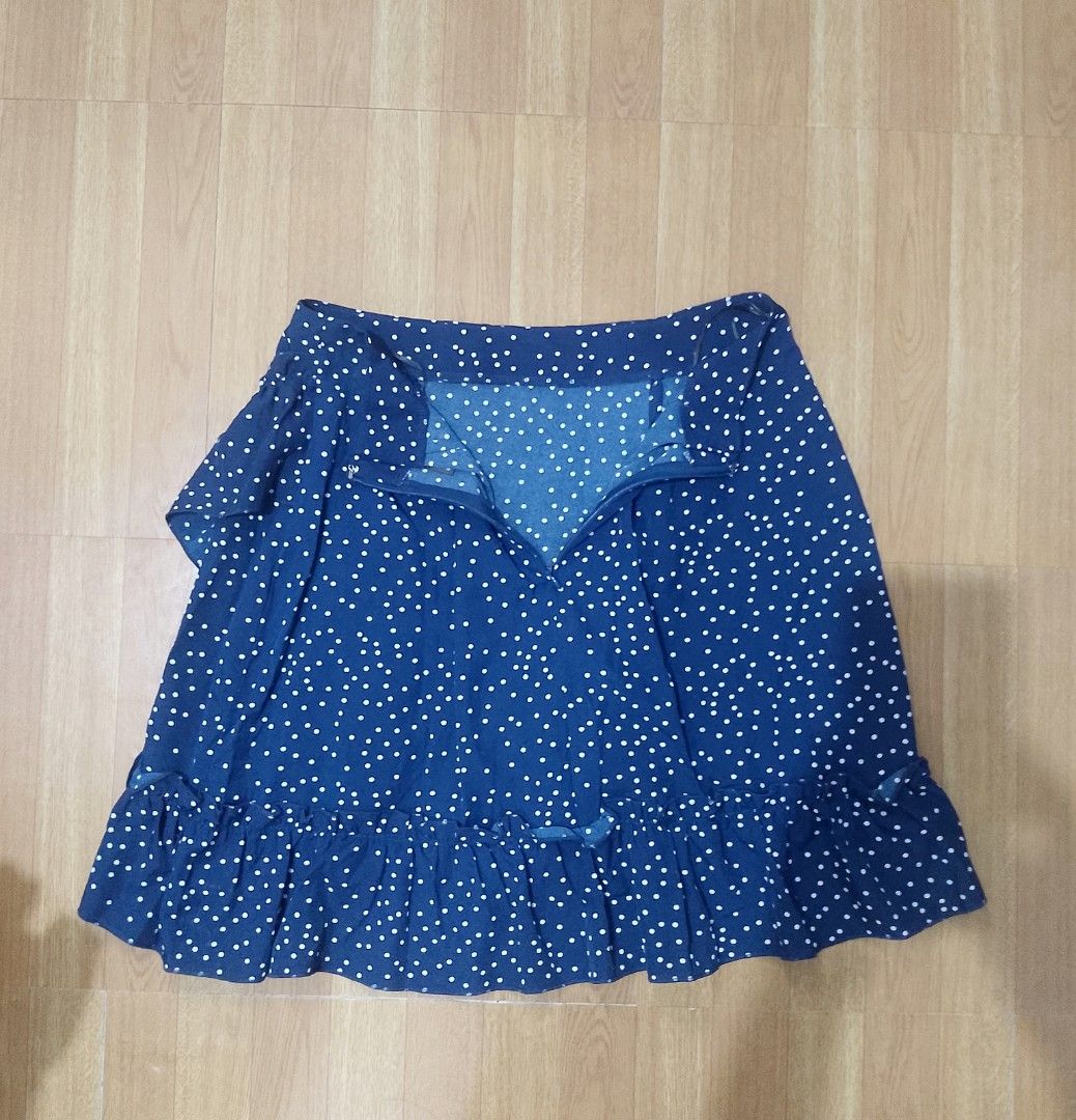 SHEIN Polka Dot Ruffle Skirt - Size M (Category: Skirts) located in Quezon City. Submitted by jay0708 (Listing ID 1402173099, Image 3). Description: - SHEIN skirt - Navy blue with white polka dots - Ruffle hem detail - Wrap style design - Size: M (EU 38, US 6) - Material: 100% polyester - Made in China P.S it's the same as the white listed item skirt just a diff color ( both items could fit a small and a medium ) pm for exact measurements.