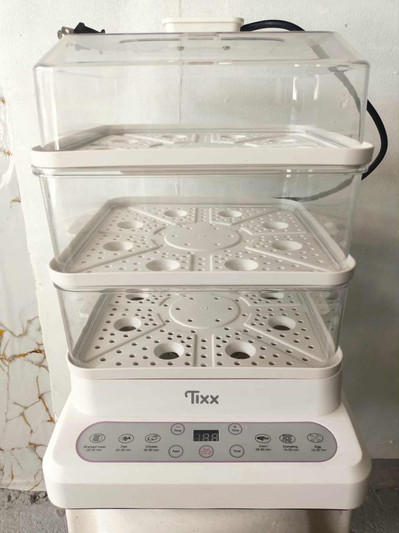 Tixx Electric Food Steamer (Category: Cookware & Accessories) located in Quezon City. Submitted by aiceabe (Listing ID 1402158450, Image 1). Description: 1 month lang nagamit sa store. Bought for 700+, selling for 550 nalang Loc: Novaliches QC Tixx electric food steamer features multiple tiers for steaming various foods simultaneously. It has a digital display and preset cooking options for different types of food, including meat, fish, chicken, 