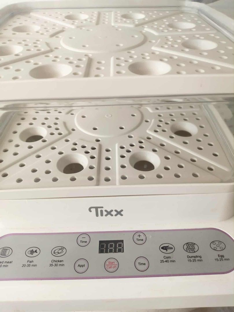 Tixx Electric Food Steamer (Category: Cookware & Accessories) located in Quezon City. Submitted by aiceabe (Listing ID 1402158450, Image 2). Description: 1 month lang nagamit sa store. Bought for 700+, selling for 550 nalang Loc: Novaliches QC Tixx electric food steamer features multiple tiers for steaming various foods simultaneously. It has a digital display and preset cooking options for different types of food, including meat, fish, chicken, 