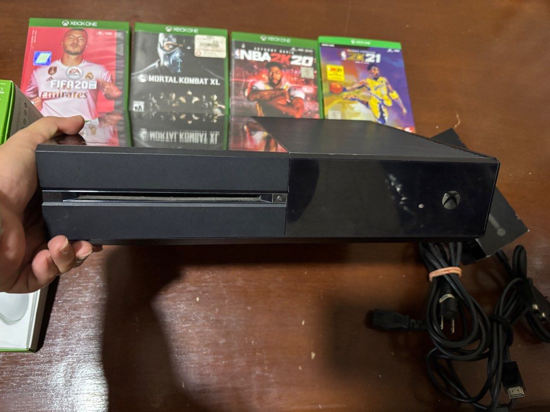 Xbox One Console (Category: Xbox) located in Manila. Submitted by senior.declutter (Listing ID 1399489210, Image 3). Description: - Xbox One console (black) - Includes one original white controller - Includes Original power box & HDMI - comes with 4 free games: NBA 2K21, NBA 2K20, FIFA20, Mortal Kombat XL - Perfect for gaming and entertainment RFS: decluttering .