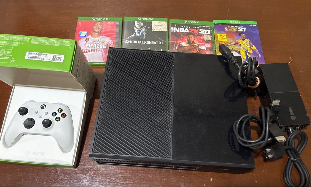 Xbox One Console (Category: Xbox) located in Manila. Submitted by senior.declutter (Listing ID 1399489210, Image 2). Description: - Xbox One console (black) - Includes one original white controller - Includes Original power box & HDMI - comes with 4 free games: NBA 2K21, NBA 2K20, FIFA20, Mortal Kombat XL - Perfect for gaming and entertainment RFS: decluttering .