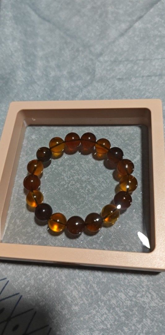 Amber Bead Bracelet - Burma 1st Gen (Category: Bracelets) located in San Juan City. Submitted by sophiespell (Listing ID 1402379826, Image 1). Description: - Amber bead bracelet - Round beads - Shades of brown and yellow - Strung on an elastic band - Includes a square display case - 1st generation legitimate Burmese Amber - great benefits for healing and positive energy PRICE SLIGHTLY NEGOTIABLE .