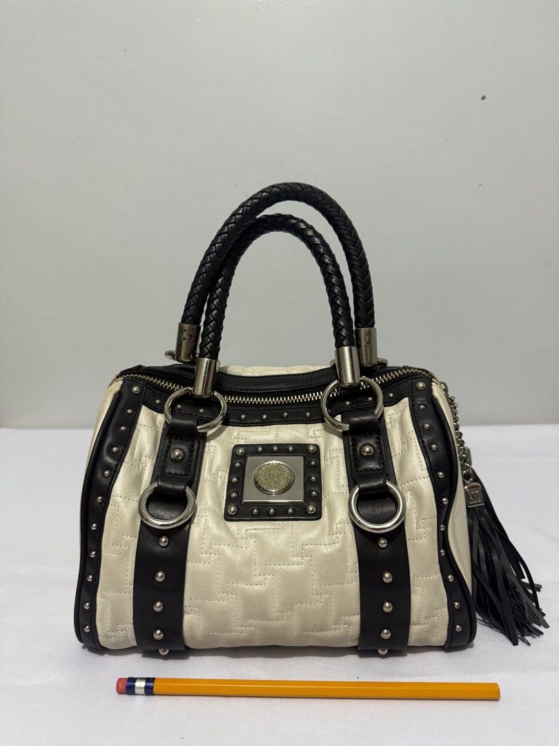 Anne Klein Handbag with Braided Handles (Category: Luxury Bags & Wallets) located in Davao. Submitted by rebaggedph (Listing ID 1402405834, Image 1). Description: Anne Klein handbag features a cream and black color scheme with a quilted pattern. It has braided handles and silver-tone hardware. The bag includes a zipper closure and a tassel detail. The Anne Klein logo is visible on the front and inside the bag. The bag has a rectangular shape with