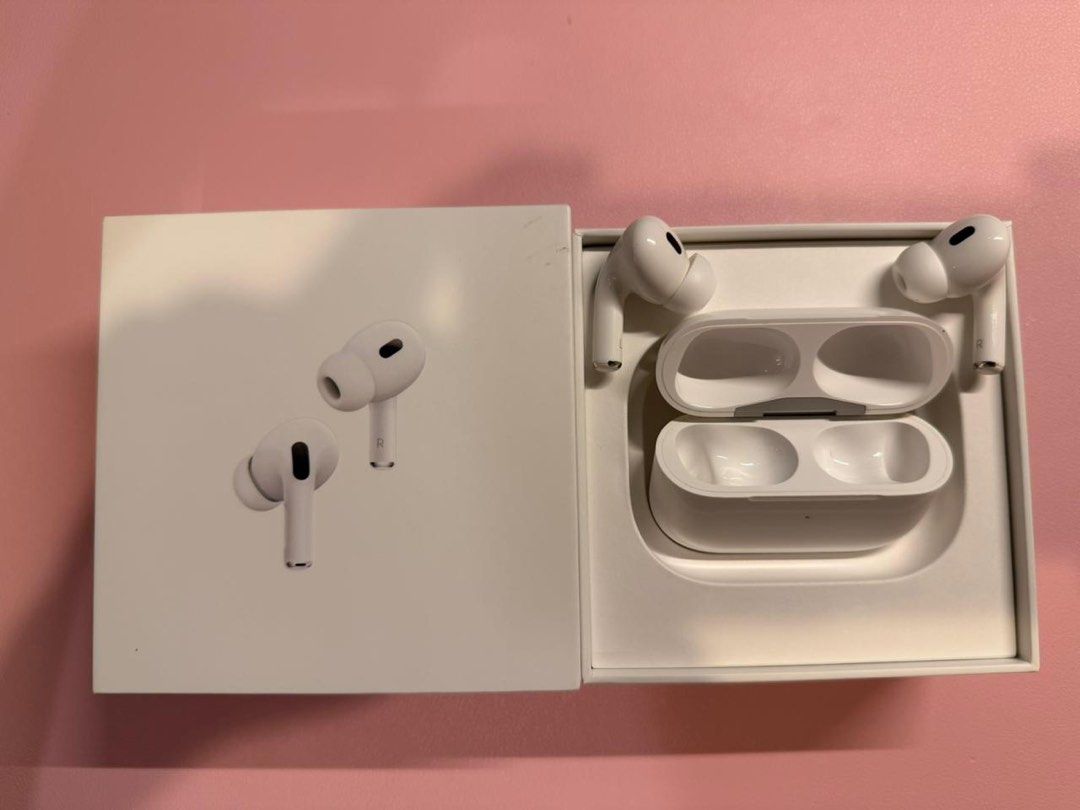 Apple AirPods Pro 2nd Generation (Category: Earphones) located in Manila. Submitted by mr.arnie (Listing ID 1402362883, Image 2). Description: - Apple AirPods Pro 2nd Generation - Includes MagSafe Charging Case - Lightly used - White AirPods and charging case - Box features product image and information.