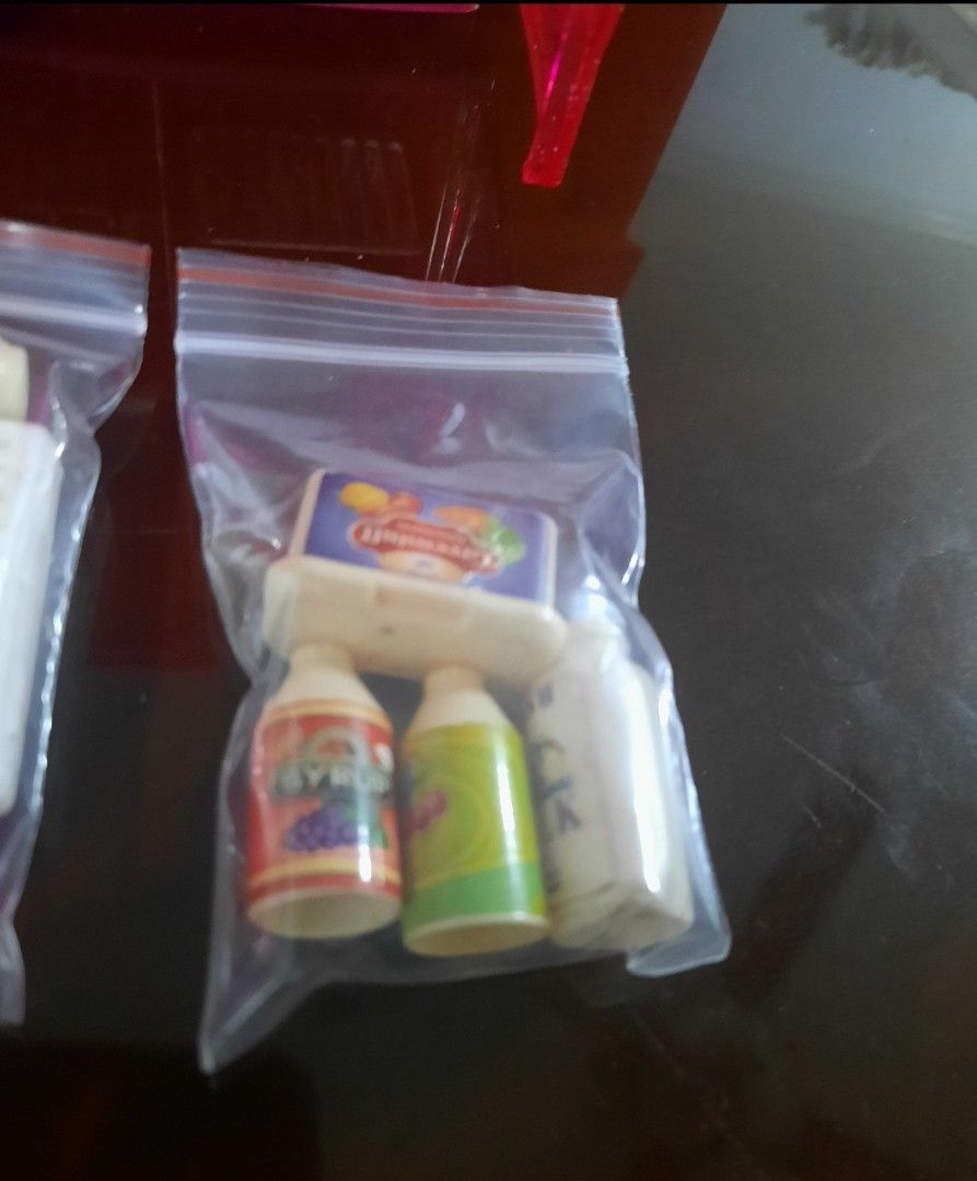 Barbie Pink Refrigerator with Accessories (Category: Kids Toys) located in Quezon City. Submitted by bonasheryl63965 (Listing ID 1402324998, Image 2). Description: - Pink dollhouse refrigerator - Includes miniature food items: milk cartons, juice bottles, cake - Features shelves and doors - Accessories packaged in clear bags - Ideal for dollhouse play includes 1 doll.